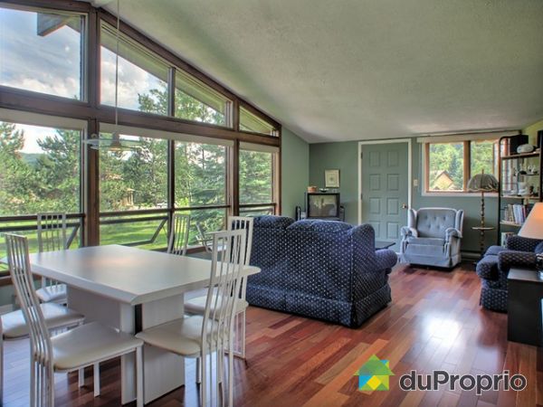 Dining Room / Living Room - Exterior door on the side of the house leading to the patio with retractable awning.