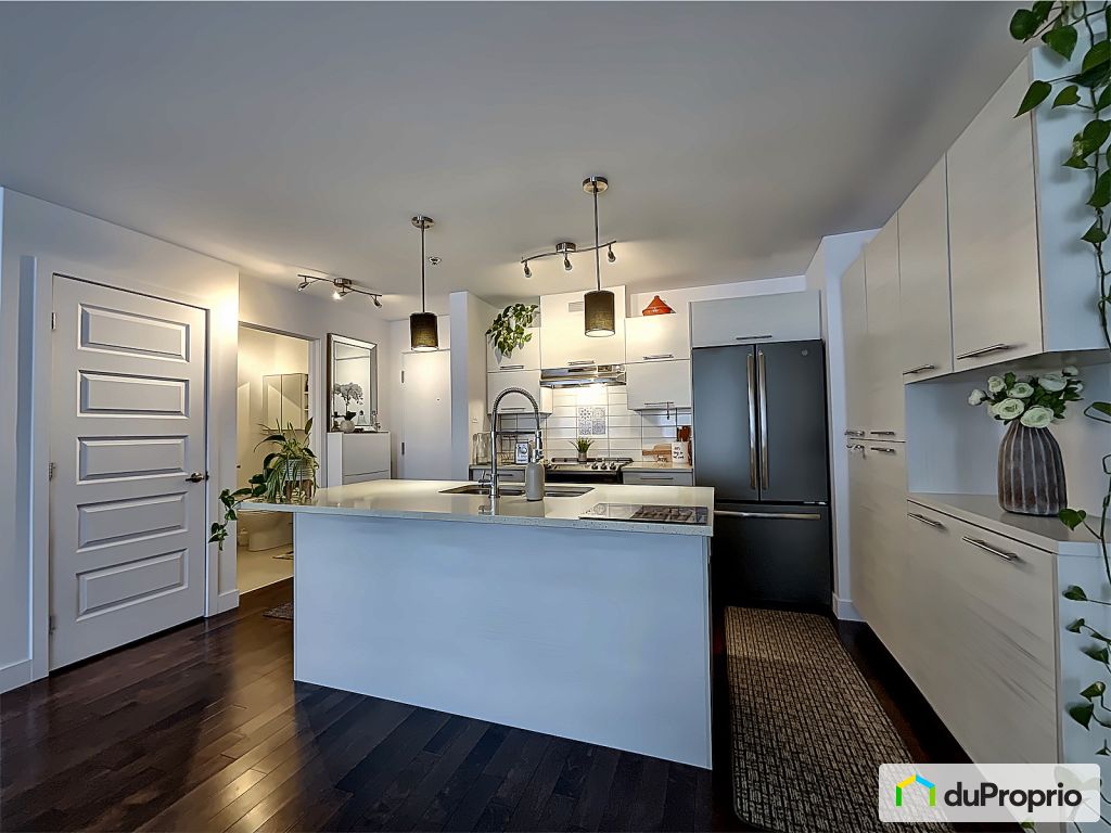 Modern Kitchen at Terrebonne  Quartz counters, laminate cabinets